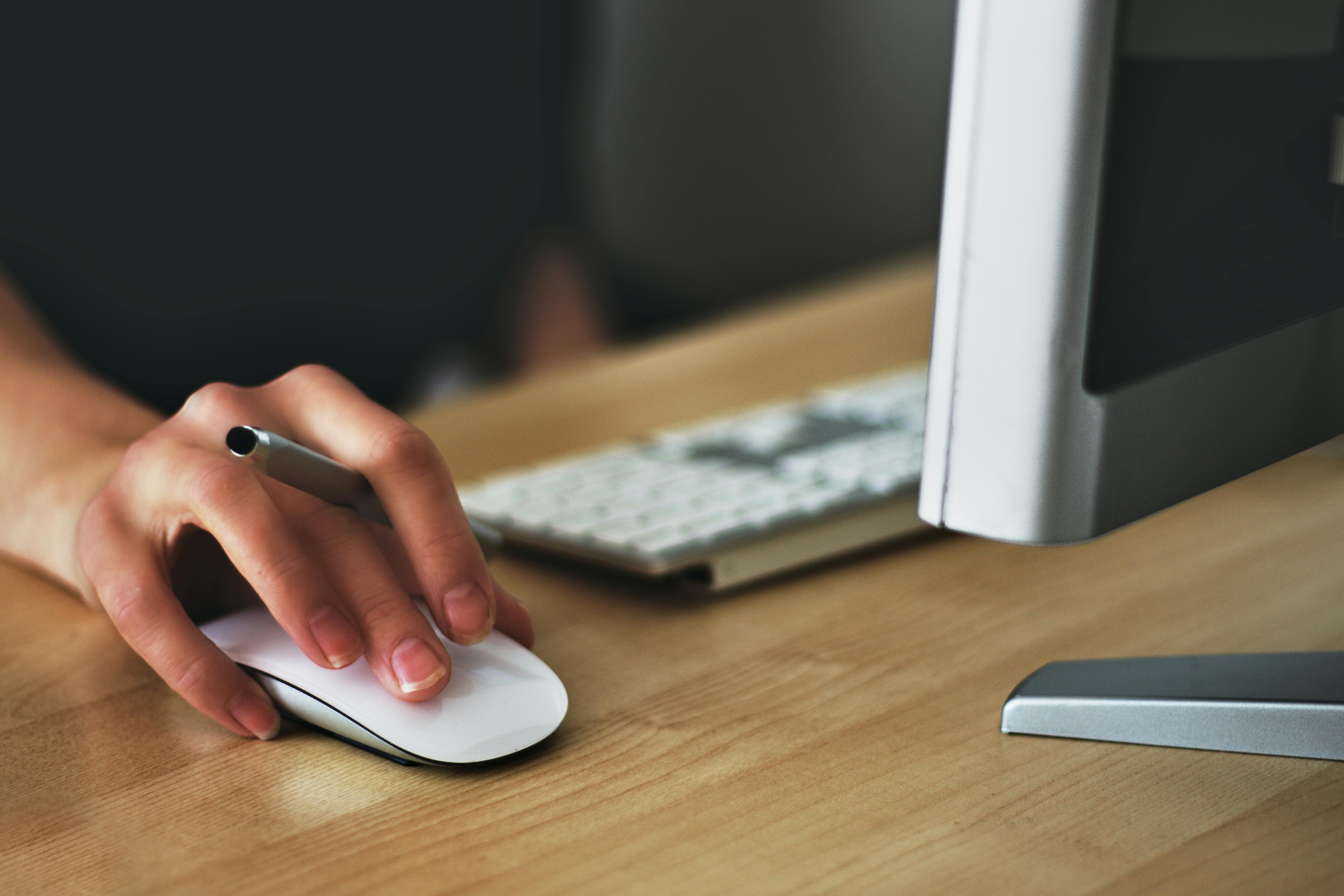 person using mouse for computer